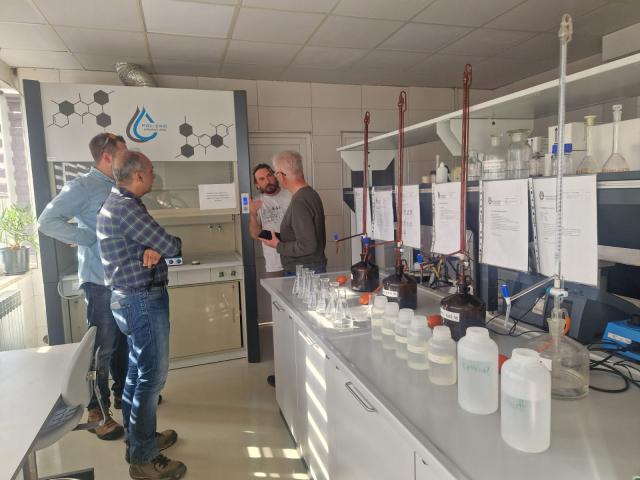 Experts discussing at the water utility company lab 