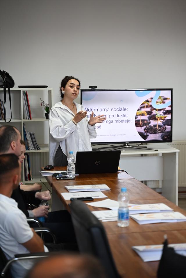 A young woman pitching her idea to panel