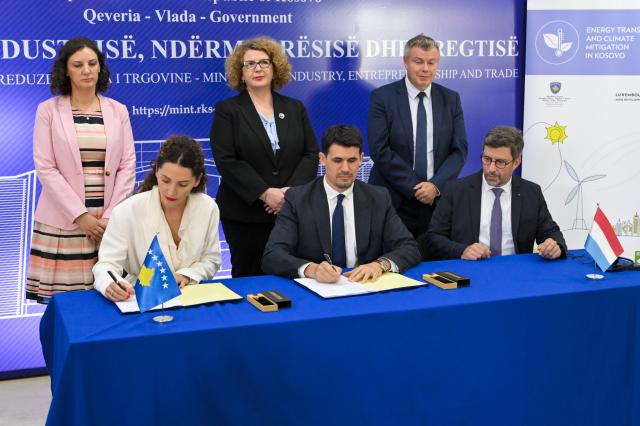 Group of people signing agreement