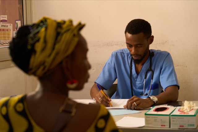 Doctor seeing a woman for a consultation