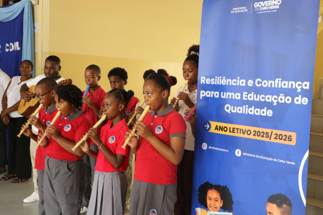 Pupils in uniform playing the flute