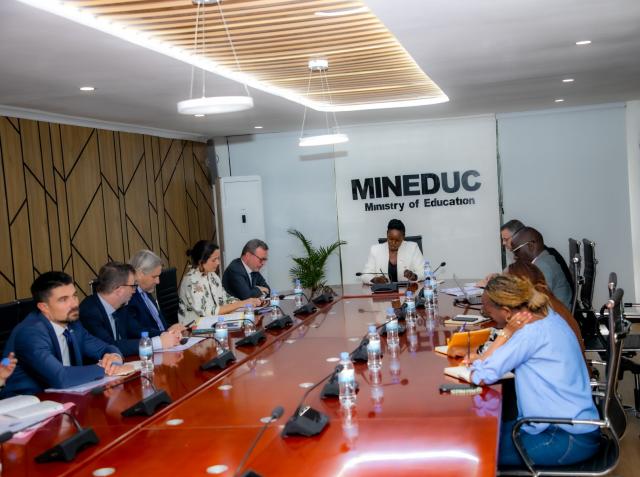 Men and women around a table in a meeting room