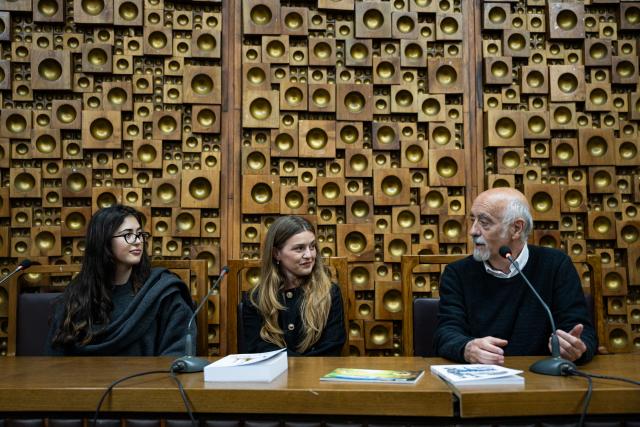Three people sitting during opening of GRAN Festival