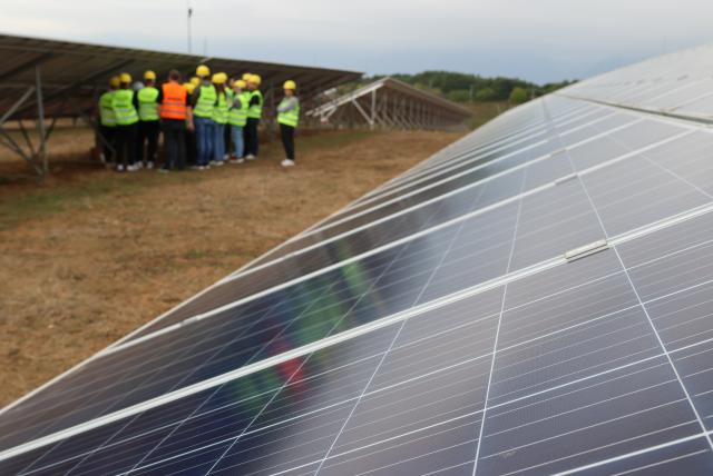Students in the field training for solar systems