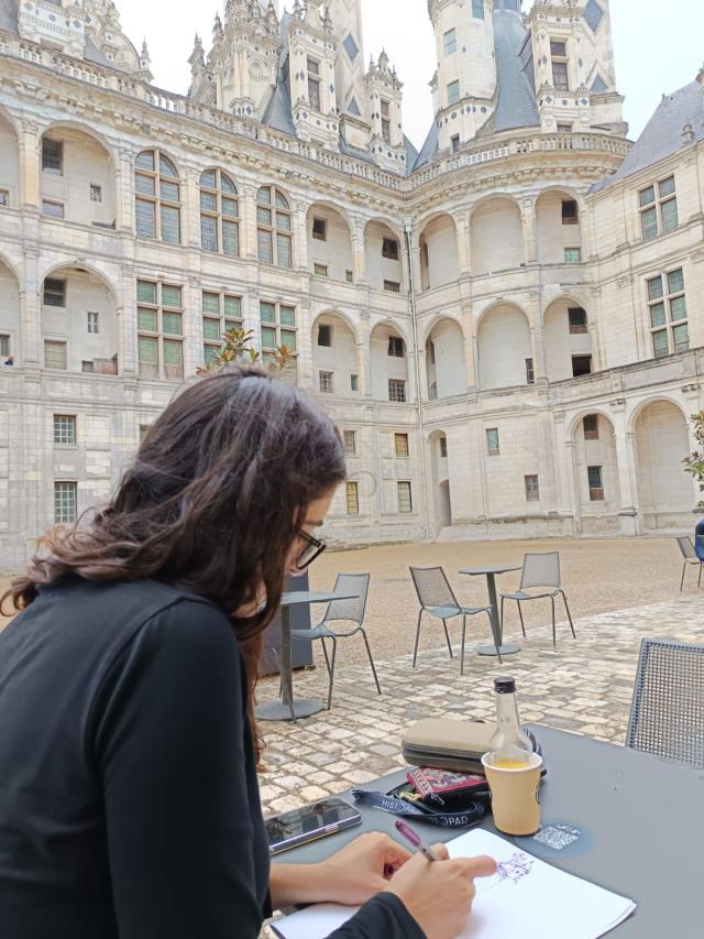 Liza drawing lines of a castle