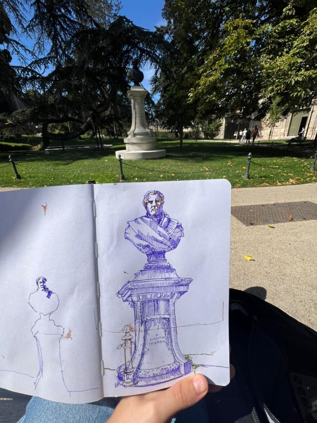 Liza sketching at a public park