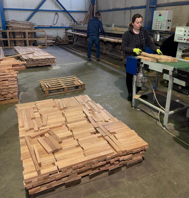 Two persons working in a wood workshop