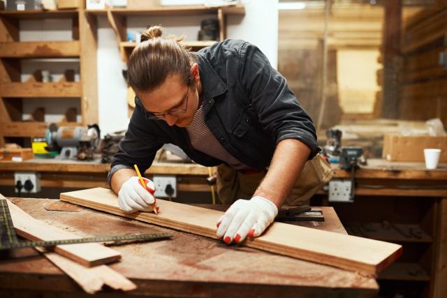 Man in a wood processing workshop
