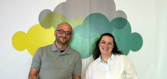 Two people smiling