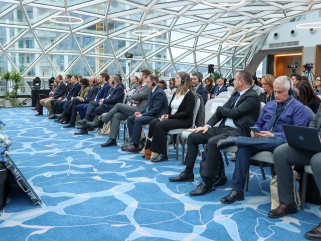 Participants sitting in the audience fo the summit