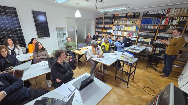 Participants attending a lecture in a training room