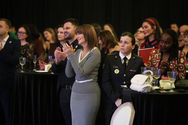 Former President Jahjaga applauding during the event