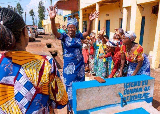 Group of women next to a water infrastructure
