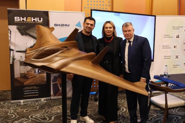 Ambassador Dietz posing in front of wood creations at Wood Convention Kosovo 2025
