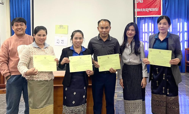 People standing and holding certificates