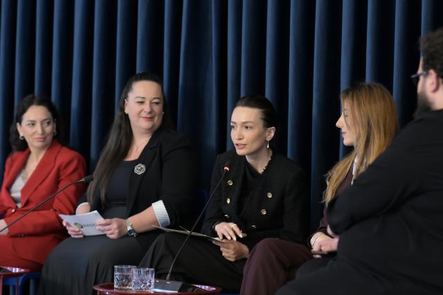 Women panelists discussing during the event