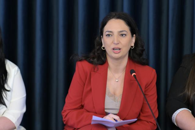 Woman panelist speaking during the event 