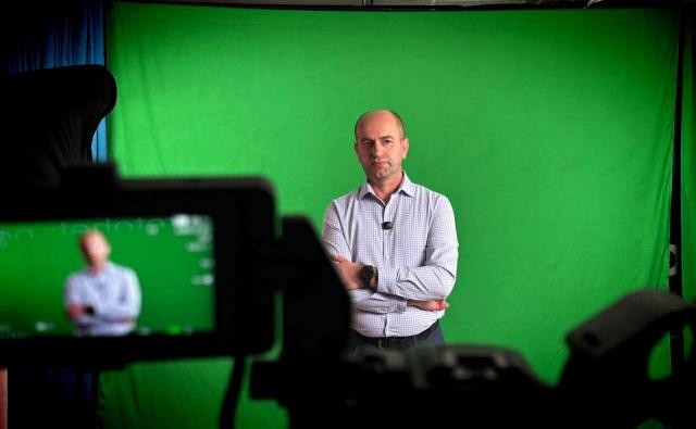 Man preparing to speak in front of camera
