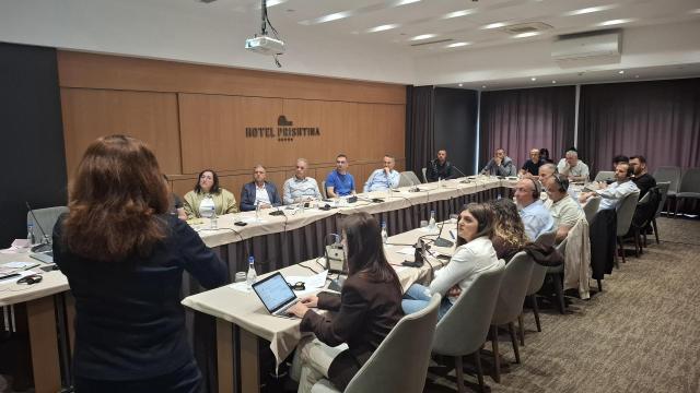 Energy experts speaks to participants during training on HVAC inspections
