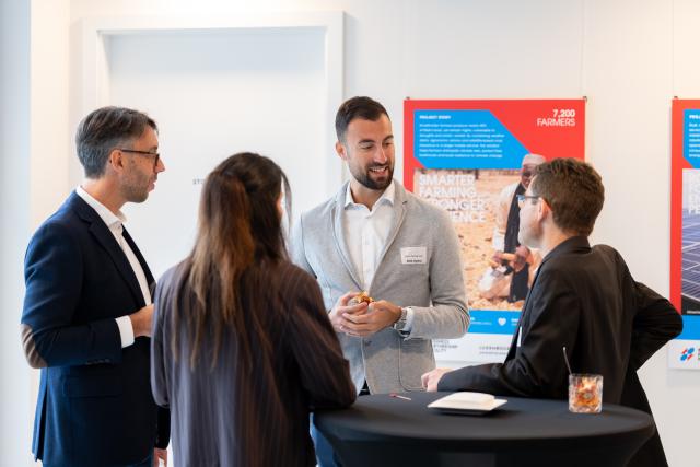 4 persons in a networking cocktail